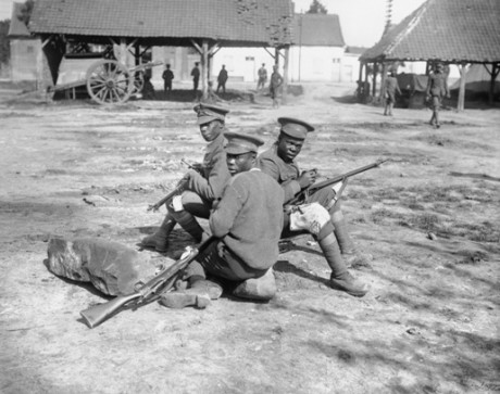 Q 1201: Troops of the West Indies Regiment cleaning their rifles on the Albert - Amiens road, September 1916.